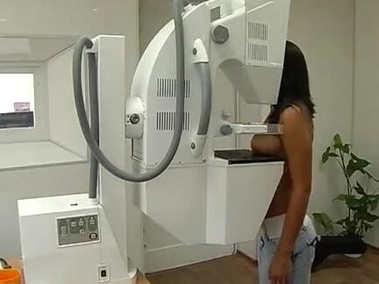 Brown-skinned Woman having a Mammogram