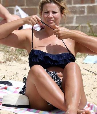 Fiona Falkiner shows off her curves in a tiny two piece at Beach